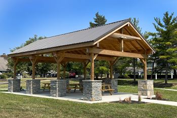 A pavilion with picnic tables in a park